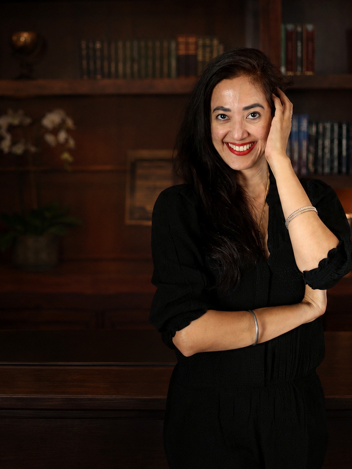 Founder of Inspirare in a quiet library setting